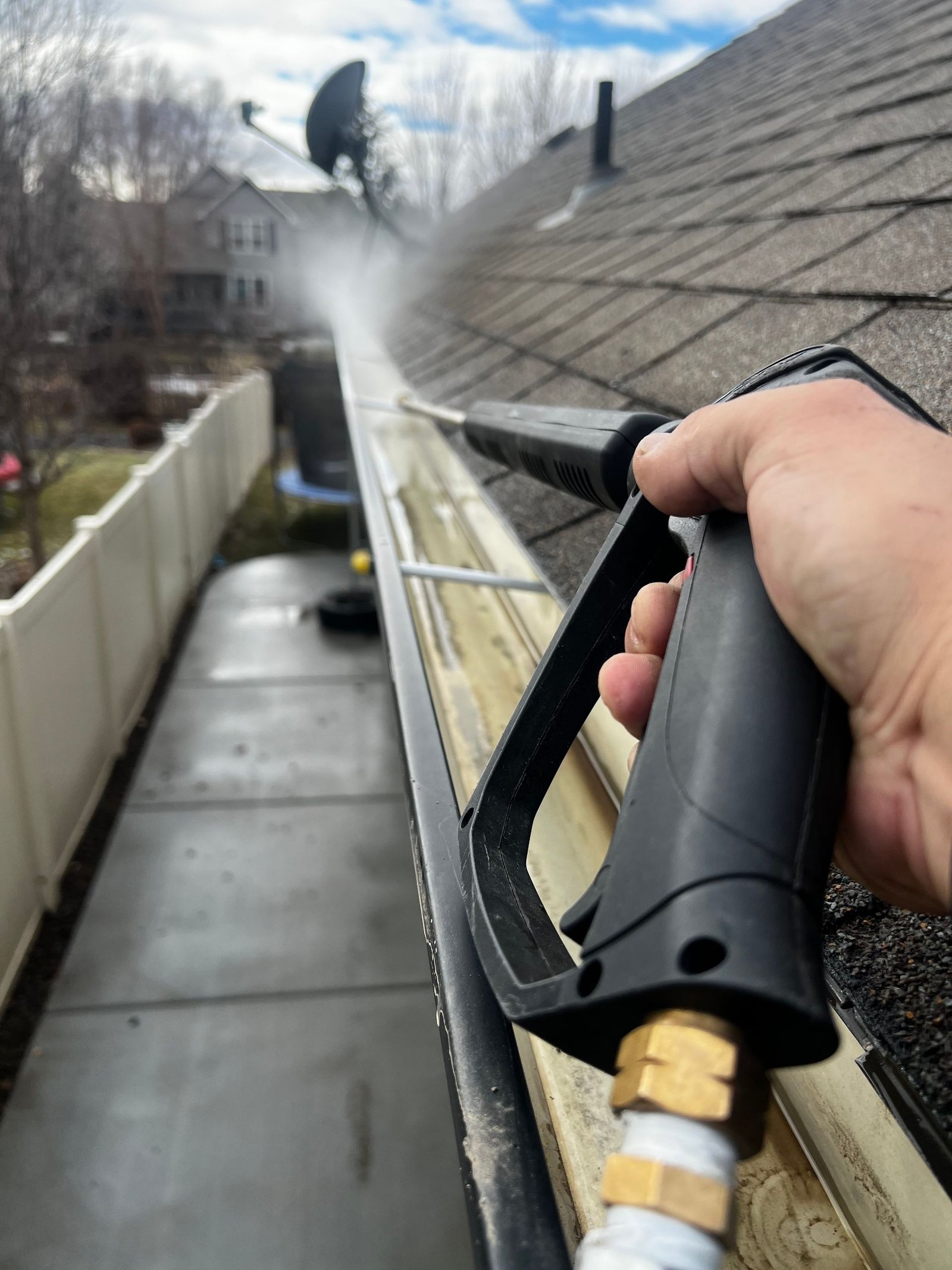 Professional exterior cleaning service technician at a Jacksonville, FL home